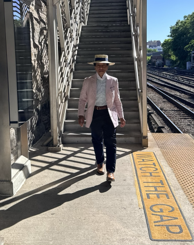 Walking on the train platform in my sunday best seersucker jacket and straw hat. 