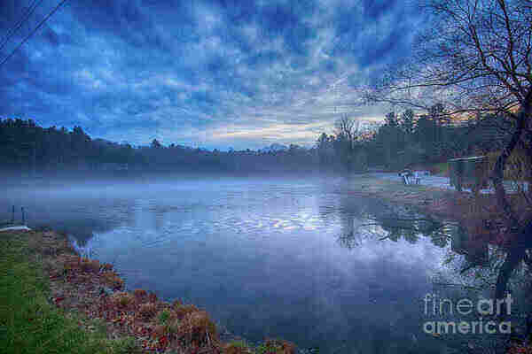 Color photo of mist rising from a small pond in early December
