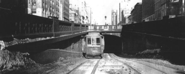Black and white photo showing how trains go under Park Ave. in NYC.