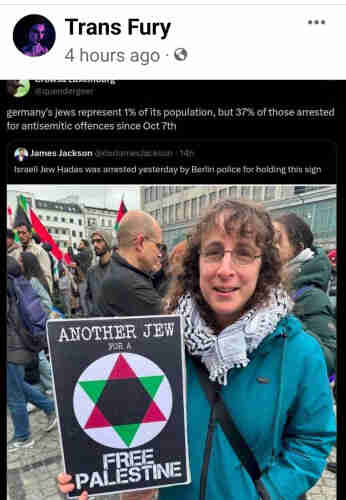 Woman in a blue jacket, and kefiyeh, holding a sign that says: another jew for a free Palestine. 

Caption reads: Germanys jews  represent 1% of its population, but 37% of those arrested for antisemitic offenses since Oct 7.