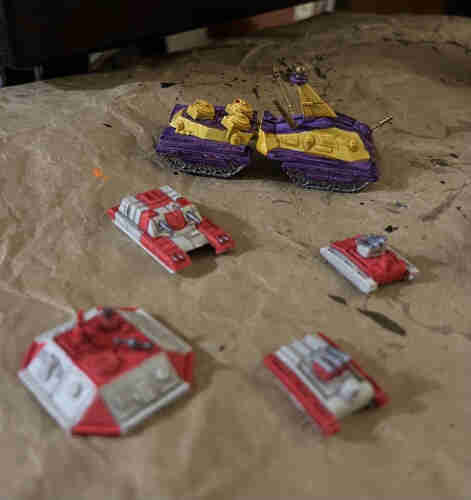 Ogre (SJ Games Tanks) Miniatures

Command post, superheavy tank, and two missile tanks in red and off white. 

Mark IV Ogre in purple and yellow