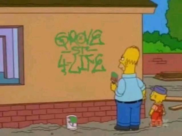Still image. Animated still from The Simpsons, Lisa and Homer have just finished painting on a house wall and stand back to admire their work. The wall reads "Grove St 4 Life". 
