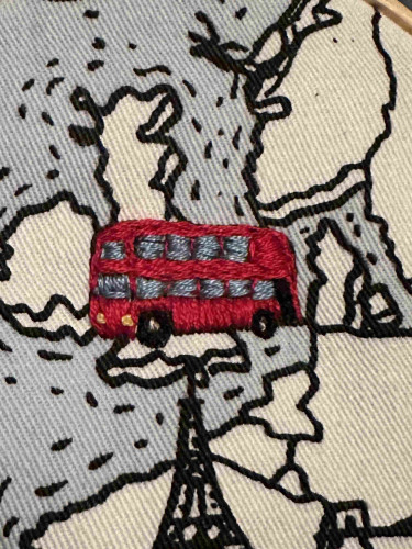 Small red embroidered double decker bus 