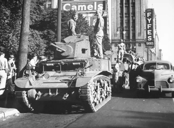 U.S. army tanks patrolling the streets of Detroit during the 1943 racist riots.