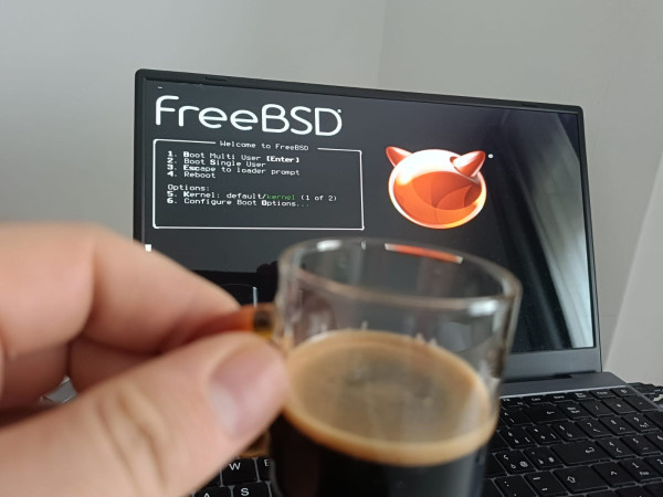 Photo: An espresso and a FreeBSD laptop background