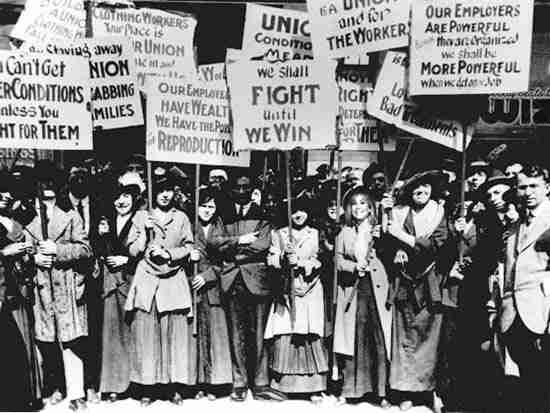Women protesters with picket signs. Two of them read, “We shall fight until we win,” “Our employers are powerful; We shall be more powerful.”