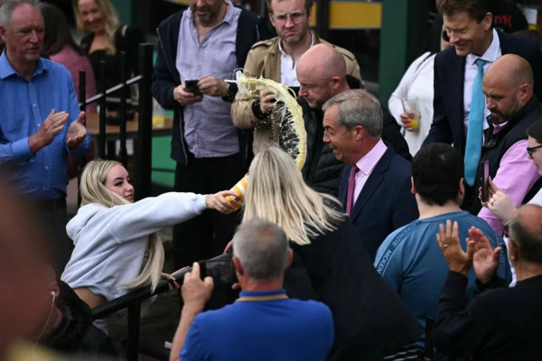 Nigel Farage getting milkshaked