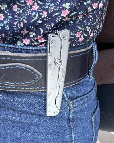 A metal object on my belt, is it a pocket knife? It has metric ruler markings is 8cm long folded— made of titanium 