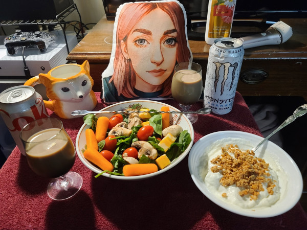 A romantic dinner with Pillow-Alice consisting of chocy milk, Monster, yummy salad, fox mug, and greek yogurt