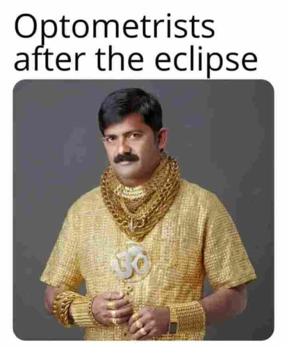 Title text: Optometrists after the eclipse

A man fully clad in gold. He wears lots of gold chains and arm braces.