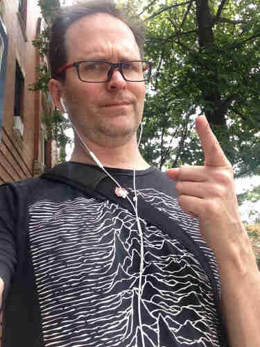 Me pointing at you with a stern expression while wearing a Joy Division t-shirt and a Russian communist youth pin.