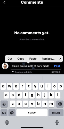 Screenshot of Pixelfed iOS beta app in dark mode with no comments displayed. A comment is being composed with text "This is an example of dark mode." A keyboard and text editing options are visible at the bottom.