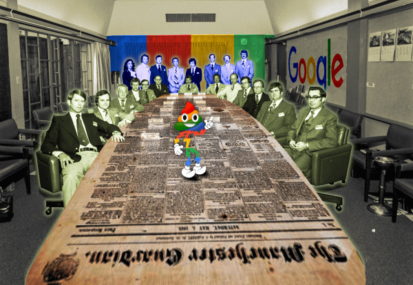 A boardroom with a long table; executives are clustered around it in 1960s garb. The table's surface has been replaced with a 19th century edition of the Manchester Guardian. The back wall of the room has been redone in Google logo color stripes. One wall features a Google logo. In the middle of the table stands a cartoon mascot with white gloves and booties and the head of a grinning poop emoji. He is striped with the four colors of the Google logo.