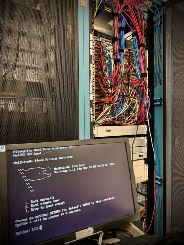 A new NetBSD 10 server booting up in the SDF main cabinet