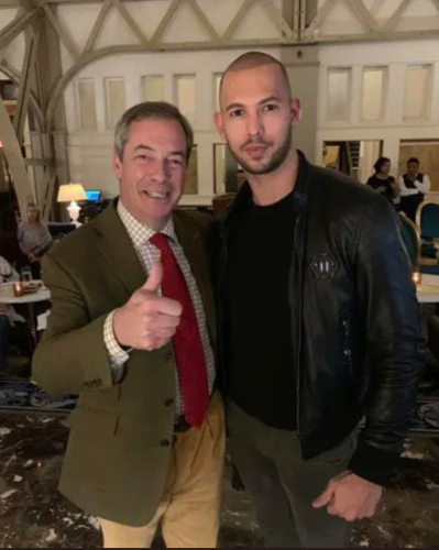Nigel Farage giving a “thumbs up” with his arm around serial rapist and all-around asshole Andrew Tate. 