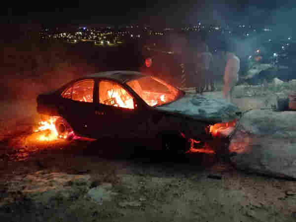 car of a Palestinian set on fire by militant settlers