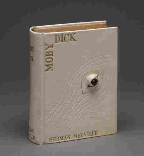 A cover for Moby Dick, made from beige leather with whale skin markings carved in and 1 3-D eye