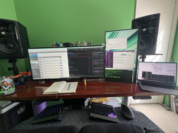my desk with two monitors, laptop, split keyboard on negative tilted tray, vertical mouse and customized mat to hold wrist rests and mouse in place