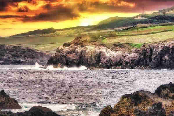 The beautiful coastal scenery of the Azores is captured in this rugged golden coast sunrise photograph. Destination of magnificence nature. Print here: https://buff.ly/485nvOe 