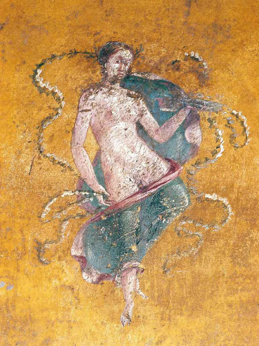 A maenad is only slightly covered by a blue piece of fabric trimmed with red. She holds a dish in one hand and seems to have leafy bunting floating artfully around her. The background is a golden yellow.