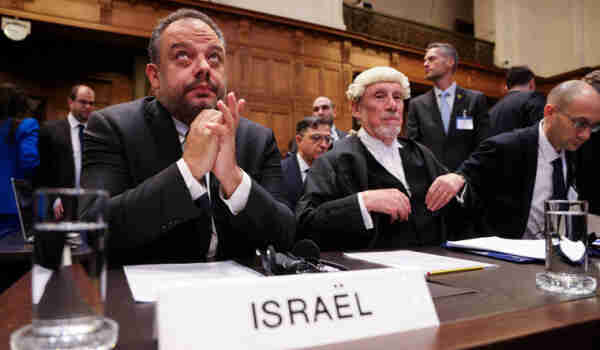 Legal adviser to Israel's Foreign Ministry Tal Becker and British jurist Malcolm Shaw sit inside the International Court of Justice (ICJ), in The Hague, Netherlands.

The photo was taken for Reuters as judges were hearing a request for emergency measures to order Israel to stop its military actions in Gaza.