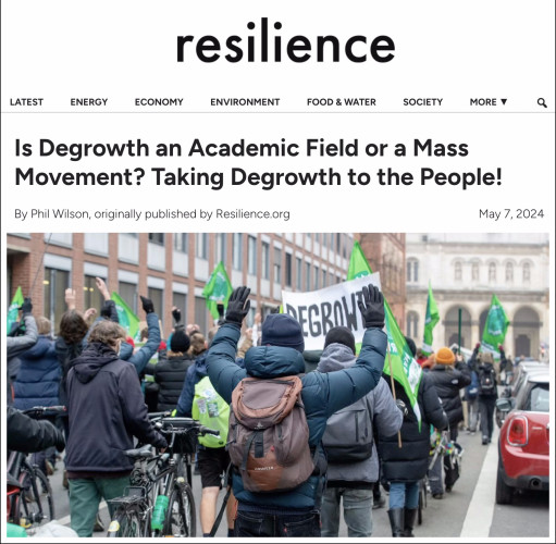 Headline from linked article says: "Is degrowth an academic field or a mass movement? Taking degrowth to the people!" Also shown is a photo of people supporting degrowth at a rally in Munich, Germany.