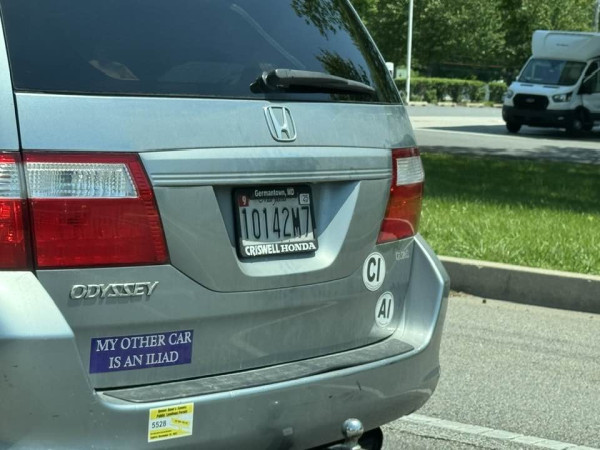 A Honda Odyssey with a bumper sticker that reads

MY OTHER CAR IS AN ILIAD