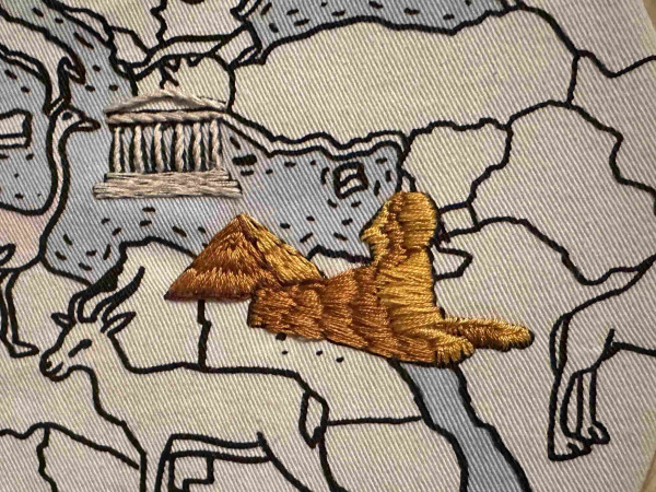 A small embroidered version of the Great Sphinx of Giza