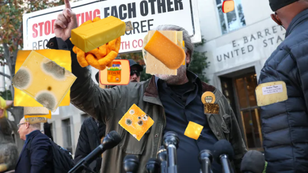 steve bannon has to report to prison "by july 1" while he appeals

pictured here holding up a finger in front of microphones with 2 moldy pieces of cheese on him.-- Extra cheese.