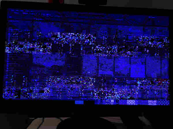My computer screen, a completely glitched out mess of colorful pixels 