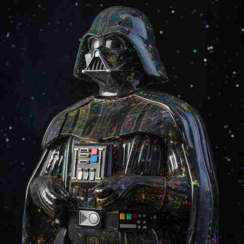 A statue of Darth Vader. His suit and helmet have an intricate, multi-colored, sparkling pattern that resembles the iridescent play-of-color seen in opals. The background is a star-filled space scene, enhancing the cosmic theme. The figure’s arms are crossed, and there are various colored buttons and panels on the chest piece of the armor. The overall appearance is of a statue with a cosmic, starry design that suggests it’s made of a material like black opal.