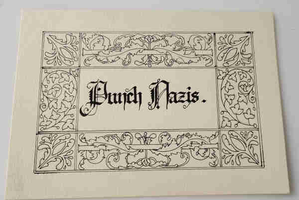 "Punch Nazis" written in blackletter calligraphy and surrounded by a black ink line art border of swirling leaves, ready to be coloured