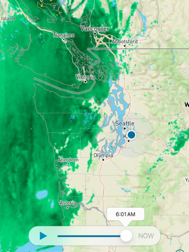Screenshot of Weather Underground app. Pacific shores and a bit of Oregon, Washington and British Columbia covered in the dark green of rain. The rain is progressing north and west. 