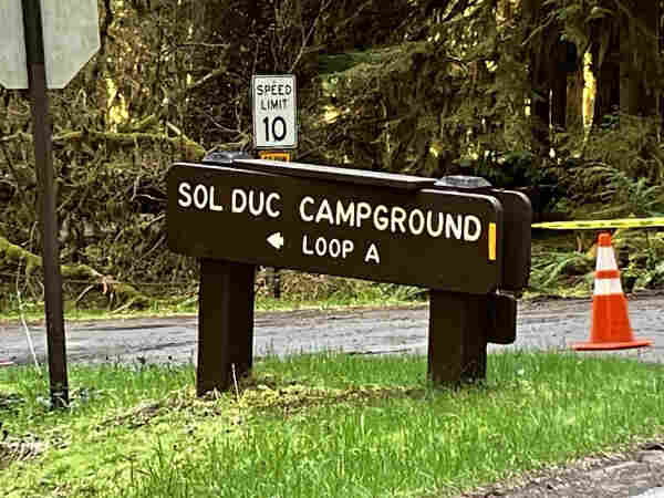 A brown sign reading "SOL DUC CAMPGROUND" with a left arrow to indicate the direction of "LOOP A"