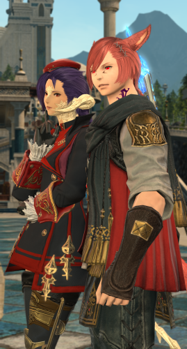 Berin Rinrin standing next to G'Raha Tia in Scholar's Harbor in Old Sharlayan. She is wearing a black, red and gold outfit, matching G'Raha's attire, and doing a thinky pose while looking in the same direction as him, off to the left side.