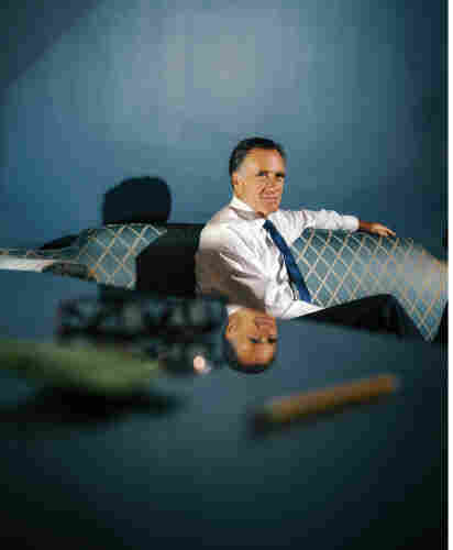 Photo of Mitt Romney sitting on  blue patterned sofa on a blue walled room

Photograph by Yael Malka