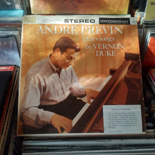 Album cover features photo of AP playing a piano.