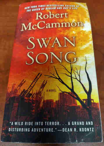 Book cover for Swan Song by Robert McCammon.

Orange and red cover with sketched city buildings. 