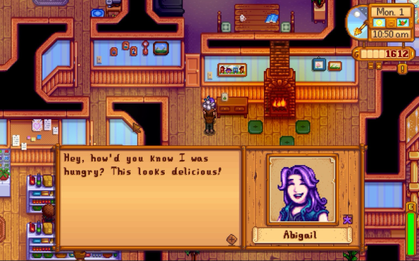 A screenshot of stardew valley. They player is handing a character a rock, which she is eating due to a bug
