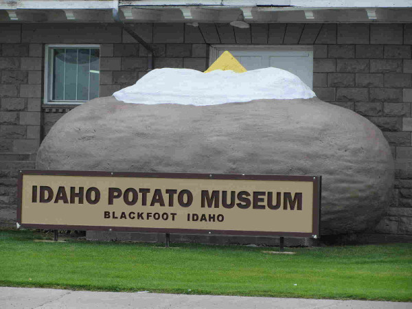 entrance to Idaho Potato Museum has a giant potato with some butter and sour cream on top. 