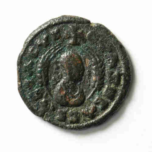 Badly worn ancient Roman coin.