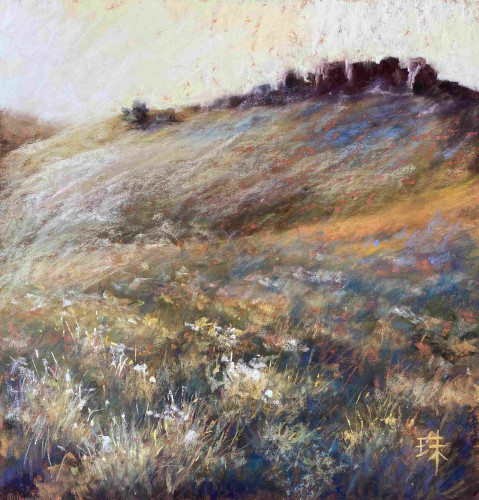 A pastel landscape painting of a hillside covered with sagebrushes. Dark rock formations on top of the hill. 