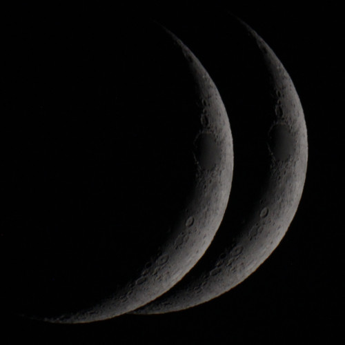a photo of a crescent moon, but duplicated so it looks like a butt.