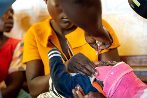 A child receives an oral Malaria vaccine, at Chileka Health Center in Lilongwe, Malawi in this undated handout photo. Benny Khanyizira/UNICEF/Handout via REUTERS 