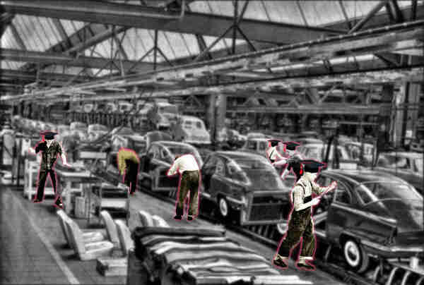 A black and white photo of a early 20th century auto assembly line. The assembly line workers have been limned in red halos and each sports a black college mortarboard.