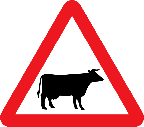 A triangular warning sign showing a silhouette of a slightly-stylised cow facing to the right.