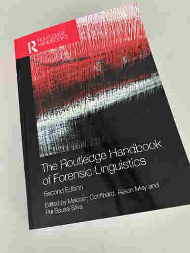 Showing the cover of a book with the title The Routledge Handbook of Forensic Linguistics. The cover is dark red and black.