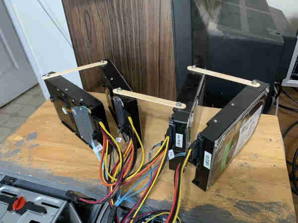 Drives temporarily connected to computer and linked with popsicle sticks to keep them from falling over