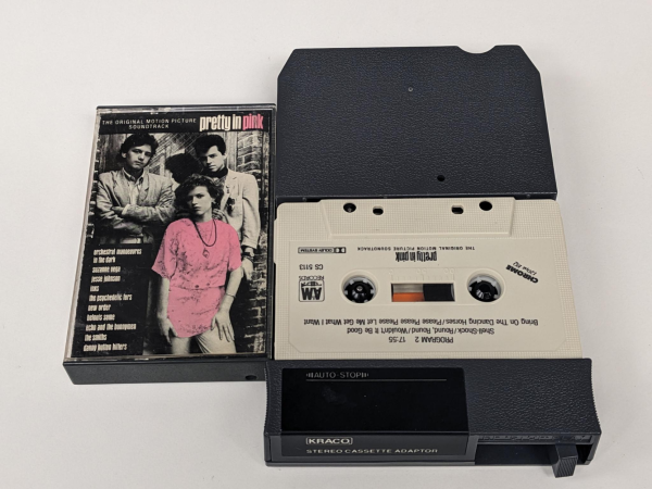 cassette box for the Pretty in Pink soundtrack next to the 8-track cassette adaptor with the cassette in it