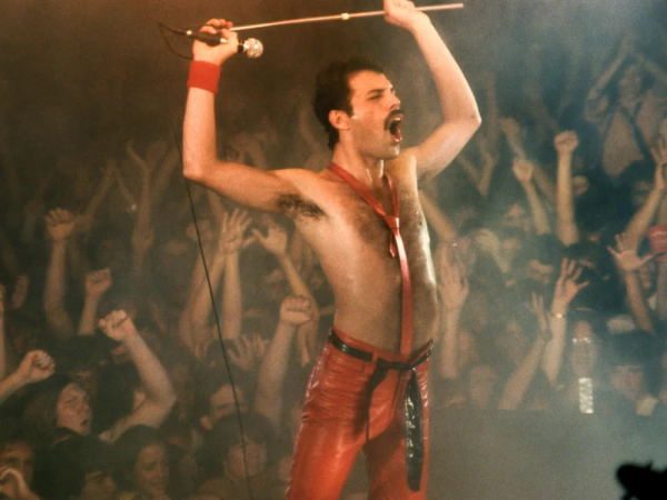 Freddy Mercury performing in front of a sea of fans